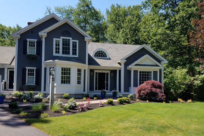 A large Maine home with a professionally planned front garden